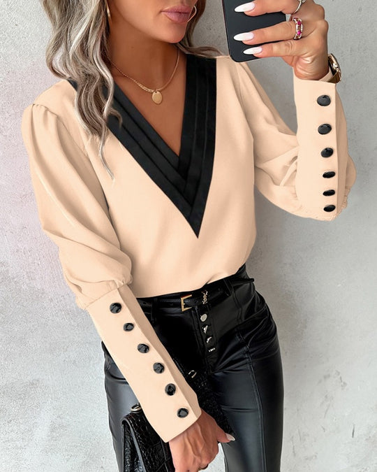 Zofia – Elegant V-neck blouse with decorative cuffs for women