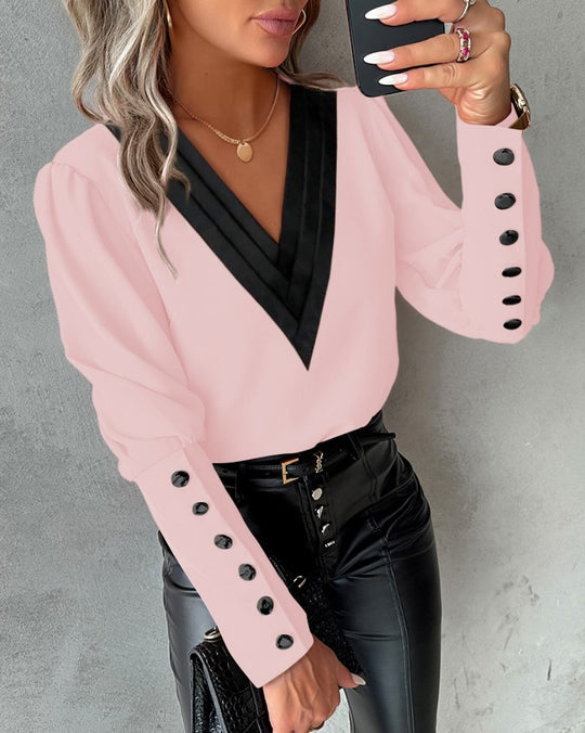 Zofia – Elegant V-neck blouse with decorative cuffs for women