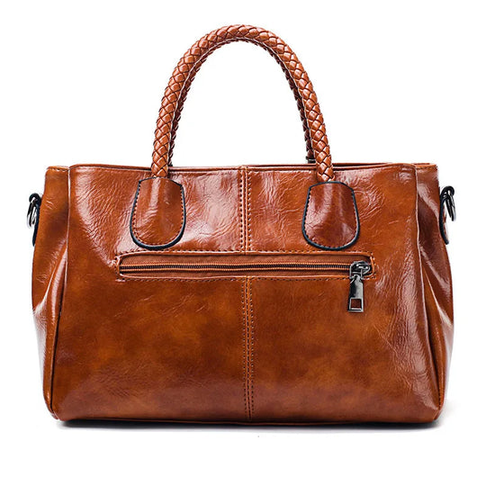 Amella – Sophisticated Leather Handbag Featuring Braided Handles